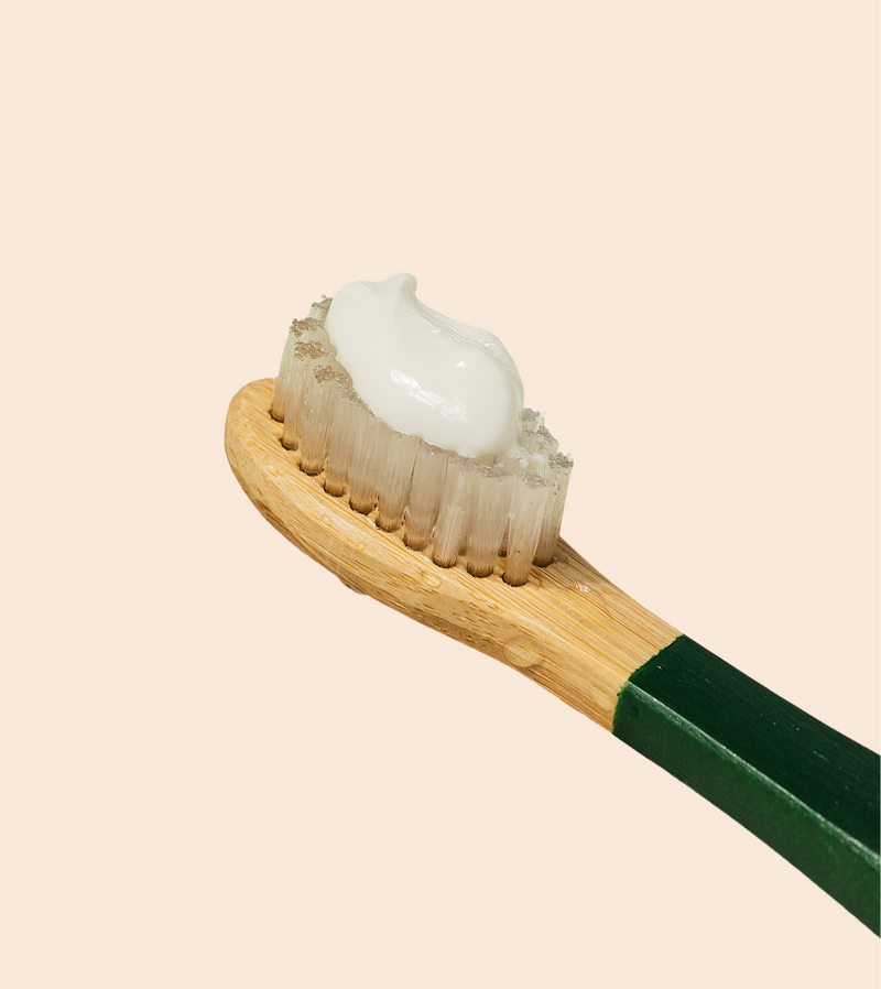 Apply toothpaste (optional)